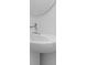 Modern bathroom sink featuring a chrome faucet and round mirror at 1133 Red Buckeye Ct, Deland, FL 32720