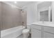 Cozy bathroom features a tub and shower combo with tiled backsplash and sink with vanity at 1133 Red Buckeye Ct, Deland, FL 32720