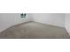 Bedroom features neutral carpet and one window overlooking the lawn at 1133 Red Buckeye Ct, Deland, FL 32720