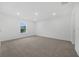 Spacious bedroom offers neutral carpet, ample natural light, and a serene ambiance at 1133 Red Buckeye Ct, Deland, FL 32720