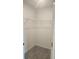 Walk-in closet with a wire shelving unit and neutral carpeting at 1133 Red Buckeye Ct, Deland, FL 32720
