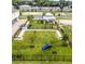 Overhead shot of the new neighborhood dog park with benches, pavilion, and play structures at 1133 Red Buckeye Ct, Deland, FL 32720