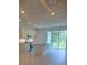 Modern, open kitchen features stainless steel appliances, granite countertops, and tile flooring at 1133 Red Buckeye Ct, Deland, FL 32720