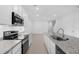 Bright kitchen boasts granite countertops, stainless steel appliances, and open layout at 1133 Red Buckeye Ct, Deland, FL 32720