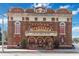 The Athens Theatre's ornate brick facade features arched doorways and striking vintage signage at 1133 Red Buckeye Ct, Deland, FL 32720