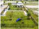 Overhead view of the dog park with an obstacle course and gazebo with benches for relaxation at 1145 Red Buckeye Ct, Deland, FL 32720