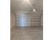 Spacious two car garage with a clean concrete floor at 1145 Red Buckeye Ct, Deland, FL 32720