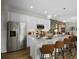 Sleek kitchen featuring white cabinets, stainless steel appliances, and a quartz countertop at 1145 Red Buckeye Ct, Deland, FL 32720
