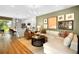 Open-concept living space with a modern kitchen and an inviting living area with an L-shaped sectional at 1145 Red Buckeye Ct, Deland, FL 32720