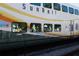 Close-up of a SunRail train with passengers visible through the windows at 1145 Red Buckeye Ct, Deland, FL 32720