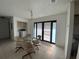 Bright dining area with glass table and chairs, laundry area with modern appliances at 1315 Veech Rd, Leesburg, FL 34748