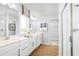 Bright bathroom boasts double vanities, a walk-in shower, and modern fixtures at 6408 Domizio Dr, Winter Haven, FL 33884