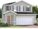 Charming two-story home featuring a light gray exterior, complemented by a two-car garage and well-maintained landscaping at 6408 Domizio Dr, Winter Haven, FL 33884