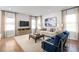 Bright and airy living room featuring neutral tones, comfortable seating, and modern decor with plenty of natural light at 6408 Domizio Dr, Winter Haven, FL 33884