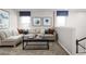 Upstairs living room features cozy seating and a view to the outdoors at 6408 Domizio Dr, Winter Haven, FL 33884