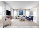 Inviting living area featuring stylish furnishings and abundant natural light from large windows at 6505 Domizio Dr, Winter Haven, FL 33884