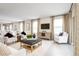 Spacious living area showcasing modern decor, cozy seating arrangements, and abundant natural light at 6509 Domizio Dr, Winter Haven, FL 33884