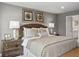 Comfortable bedroom showcasing a decorative headboard, matching nightstands, and coordinated wall art at 6524 Domizio Dr, Winter Haven, FL 33884
