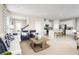 Open-concept living room with stylish furniture, neutral tones, and plenty of natural light at 6524 Domizio Dr, Winter Haven, FL 33884