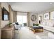 Inviting living room featuring modern furniture, neutral colors, a decorative rug, and lots of natural light at 6528 Domizio Dr, Winter Haven, FL 33884