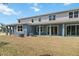 Back of house with large lawn and covered patio offers great outdoor opportunities at 5281 Luisa Ct, St Cloud, FL 34771