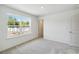 Bedroom with neutral carpet and a large window at 5281 Luisa Ct, St Cloud, FL 34771