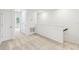 Hallway with neutral carpet, staircase, and plenty of natural light at 5281 Luisa Ct, St Cloud, FL 34771