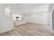 Bright open-concept living space with modern kitchen, wood-look flooring, and natural light at 5281 Luisa Ct, St Cloud, FL 34771