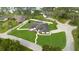 Expansive lakefront property features lush lawn, fenced yard, and screened lanai, offering privacy and serene outdoor living at 1148 Rosetta Dr, Deltona, FL 32725