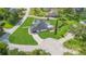 Aerial view shows the house with an inground pool and large landscaped lot at 1148 Rosetta Dr, Deltona, FL 32725