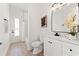 Stylish bathroom with a marble-tiled shower, modern vanity, and a well-lit mirror, creating a fresh, clean feel at 1148 Rosetta Dr, Deltona, FL 32725