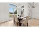 Elegant dining area with natural light, wood floors, a modern light fixture, and seating for six at 1148 Rosetta Dr, Deltona, FL 32725