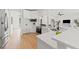 Modern kitchen features white cabinetry, stainless steel appliances, and an open layout, perfect for entertaining at 1148 Rosetta Dr, Deltona, FL 32725