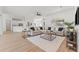 Spacious living room features modern decor, wood floors, and an open layout, perfect for entertaining at 1148 Rosetta Dr, Deltona, FL 32725