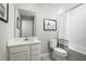 Modern bathroom featuring a vanity with a sink, a toilet, and a shower with a curtain at 1203 Port Blue Way, Lady Lake, FL 32159