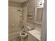 Bright bathroom featuring a tub, toilet, sink, and a mirrored cabinet at 2200 S Palmetto Ave # E050, South Daytona, FL 32119