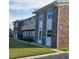 Brick townhome with manicured lawn and garden at 2200 S Palmetto Ave # E050, South Daytona, FL 32119