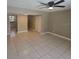 Comfortable living room boasts tile floors and neutral wall colors at 2200 S Palmetto Ave # E050, South Daytona, FL 32119