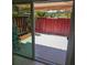 View from sliding glass door to private patio with red privacy fence at 2200 S Palmetto Ave # E050, South Daytona, FL 32119
