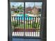 An outdoor view of a community pool, visible through the sliding glass door at 2200 S Palmetto Ave # E050, South Daytona, FL 32119