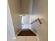 Staircase descending with a light-colored wall and handrail at 2200 S Palmetto Ave # E050, South Daytona, FL 32119