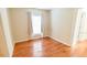 Bright bedroom with hardwood floors and a view from the window at 423 E Kaley St, Orlando, FL 32806