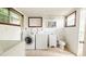 Laundry room with full-size washer and dryer set and a utility sink at 423 E Kaley St, Orlando, FL 32806