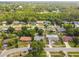 Neighborhood aerial view with homes with pools and lush green landscaping at 7289 Lake Floy Cir, Orlando, FL 32819