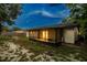 Expansive backyard featuring a screened-in porch, perfect for outdoor relaxation and entertaining at 7289 Lake Floy Cir, Orlando, FL 32819