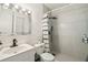 This stylish bathroom features gorgeous gray tiles, updated fixtures, and modern shower curtain at 7289 Lake Floy Cir, Orlando, FL 32819