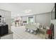 Open-concept kitchen and dining area with stainless steel appliances and dining table for six at 7289 Lake Floy Cir, Orlando, FL 32819