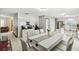 Spacious dining area boasts white tile floors and an open layout connecting it to the kitchen at 7289 Lake Floy Cir, Orlando, FL 32819