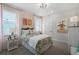 Cozy bedroom with bright windows, floral wallpaper, and charming decor at 764 Mystic Gardens Dr, Apopka, FL 32703