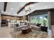 Bright and spacious living room and kitchen area with large sectional sofa and outdoor view at 847 Emerald Grove Dr, Apopka, FL 32703